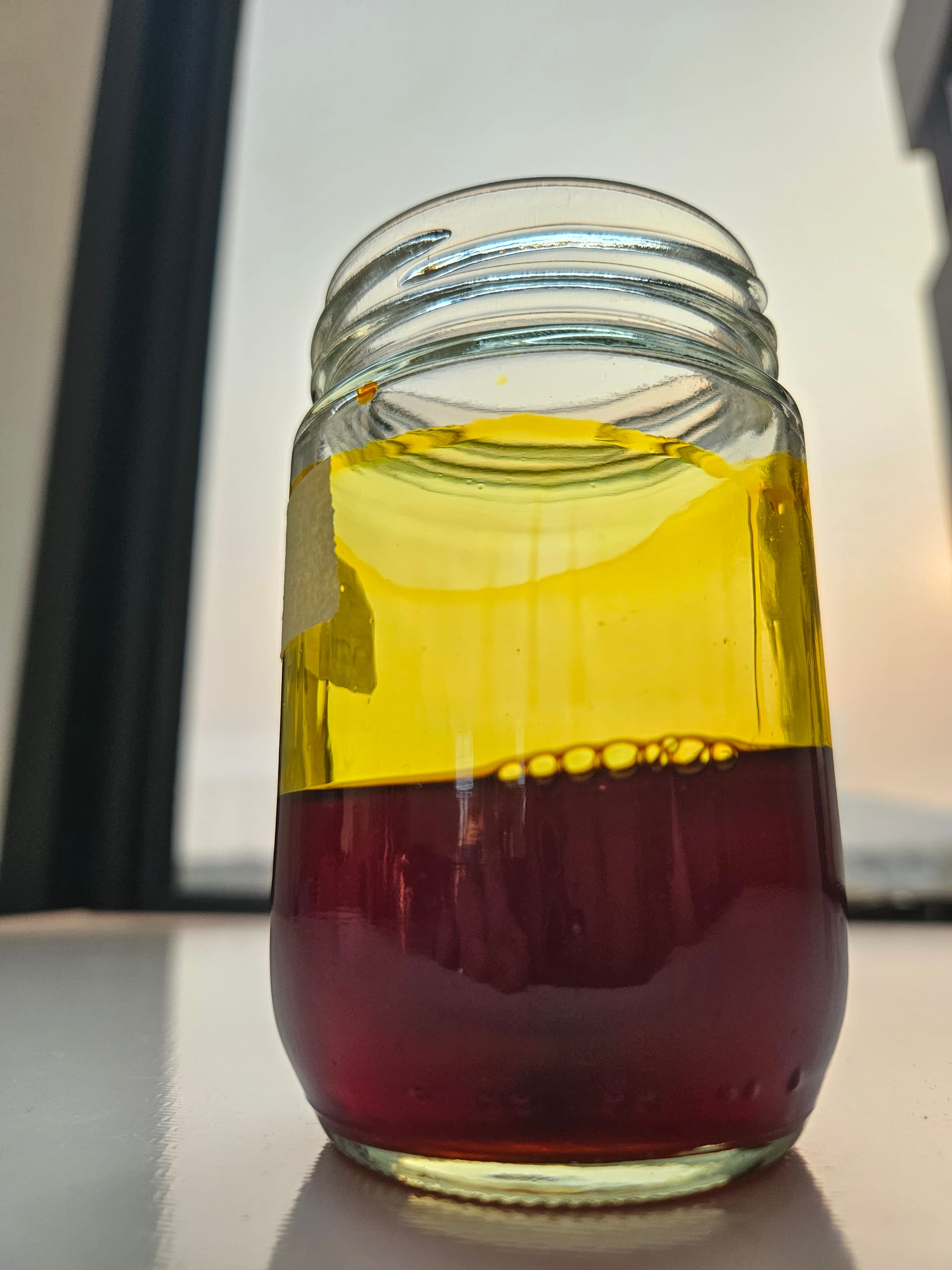 Golden-yellow Saraphi Fresh Flowers Absolute by LOSIAM in glass jar, extracted from Mammea siamensis blooms, luxurious natural perfume ingredient