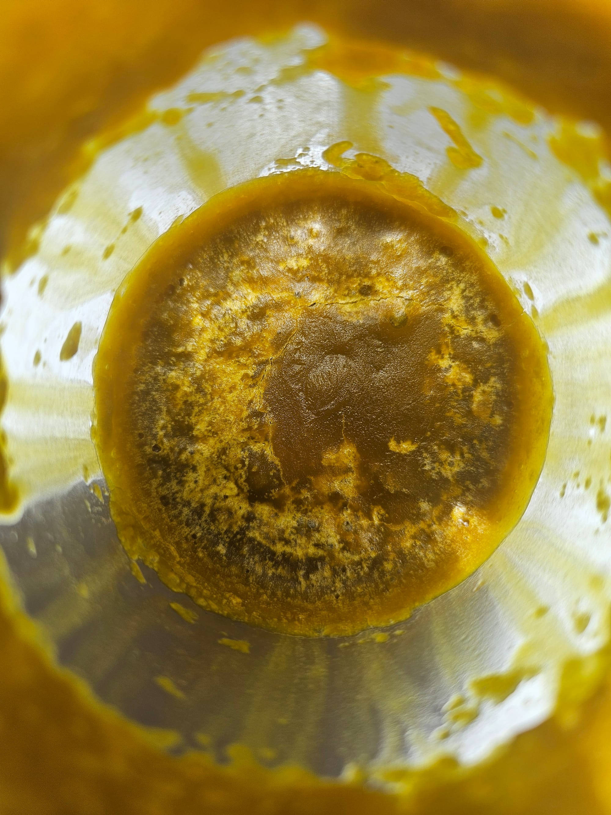 Waxy, semi-solid concrete extract — the intermediate stage before an absolute in natural perfumery